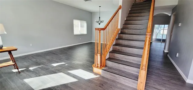 a view of entryway with wooden floor