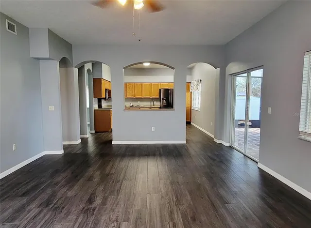 a view of a living room with wooden floor