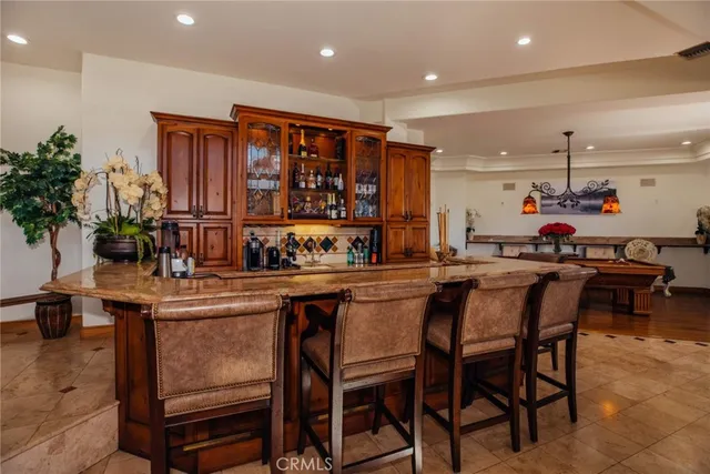 a swimming pool with an outdoor seating