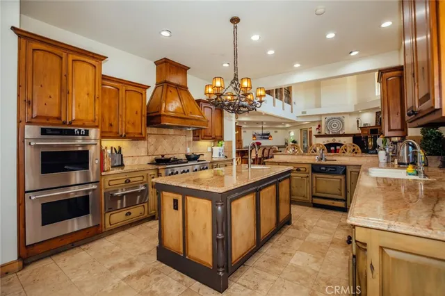 a view of swimming pool with outdoor seating and a mountain view in the background