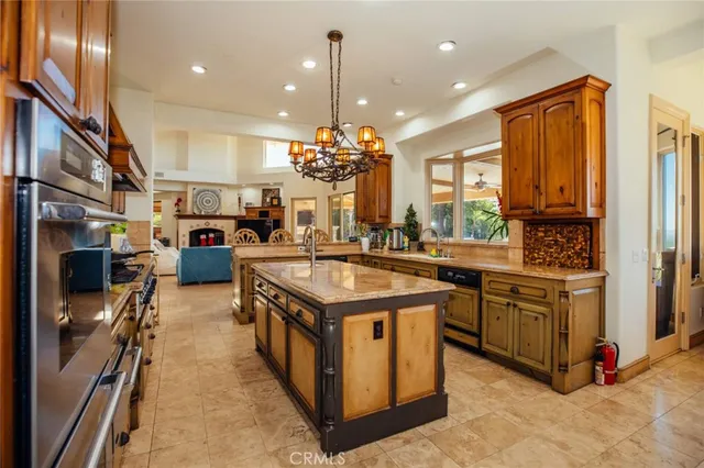 an aerial view of a house with a yard and garden