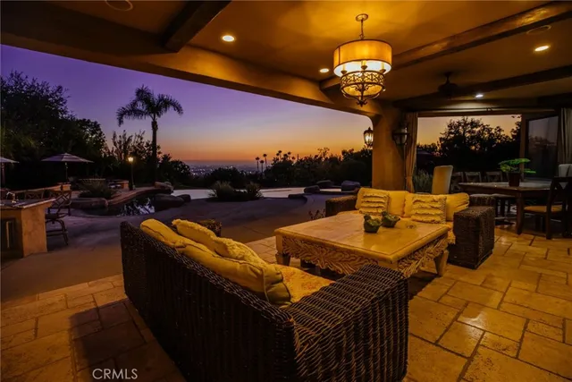 a bathroom with a granite countertop sink and a large mirror