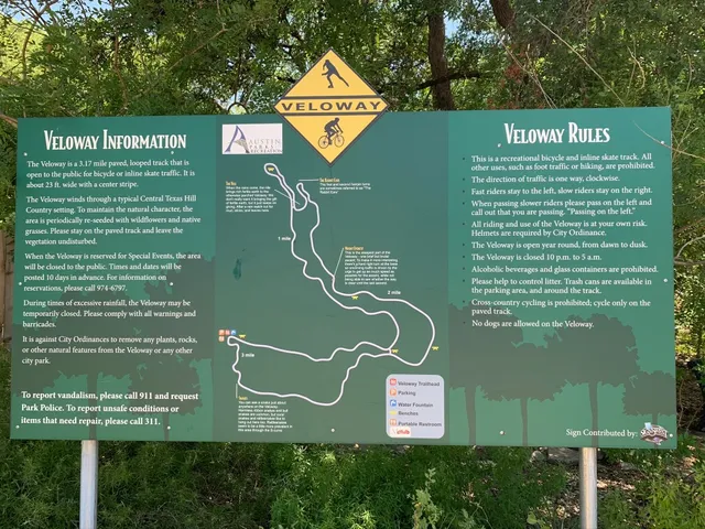 a green sign that is on the wall of a building