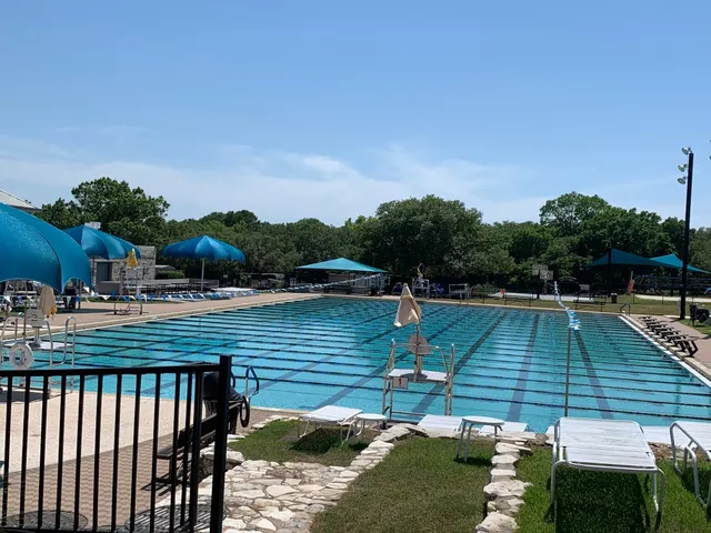 a view of deck with chairs and wooden fence