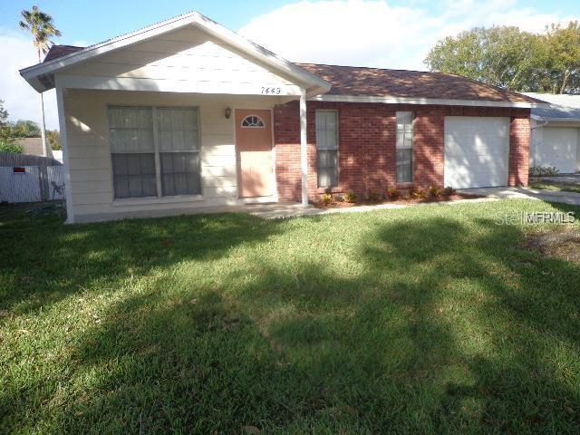 7449 Compton Lane New Port Richey, FL 34655 - Photo 1 of 1 FRONT OF HOME WITH LOVELY FRONT PORCH