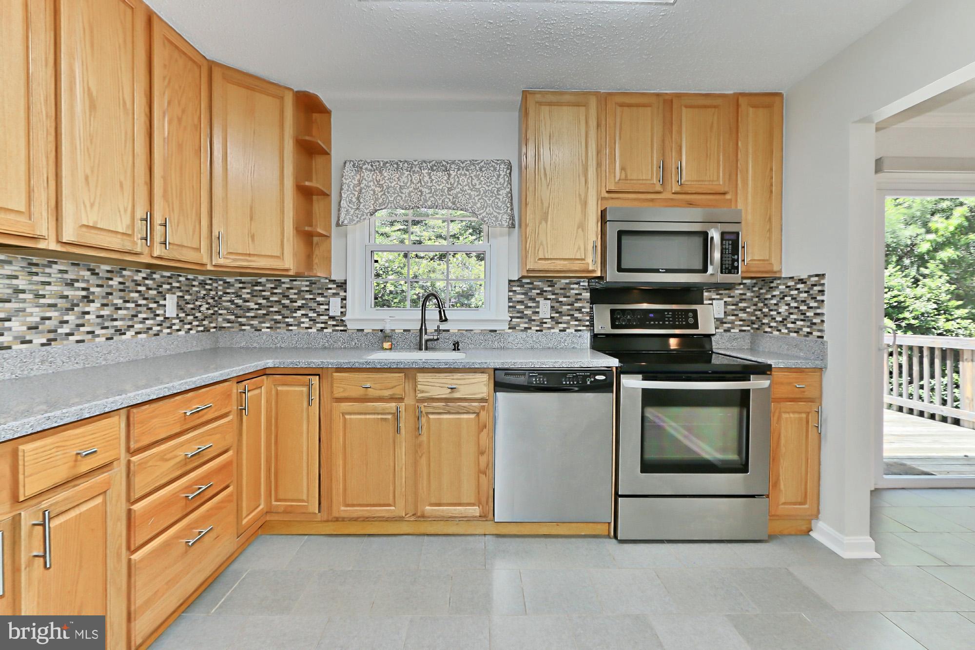 7112 Whetstone Road Alexandria, VA 22306 - Photo 11 of 30 Gorgeous renovated kitchen with table space