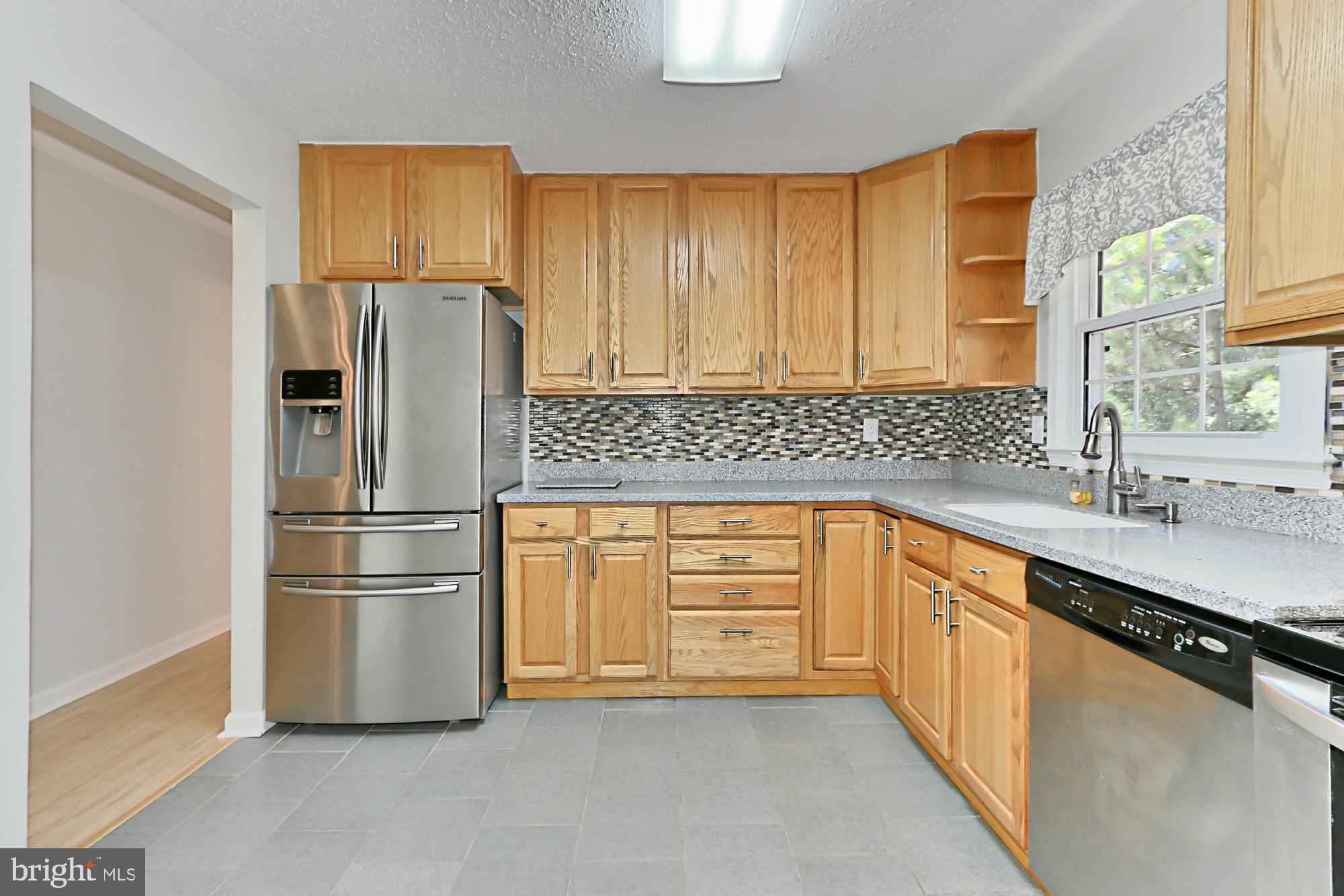 7112 Whetstone Road Alexandria, VA 22306 - Photo 12 of 30 Gorgeous renovated kitchen with table space