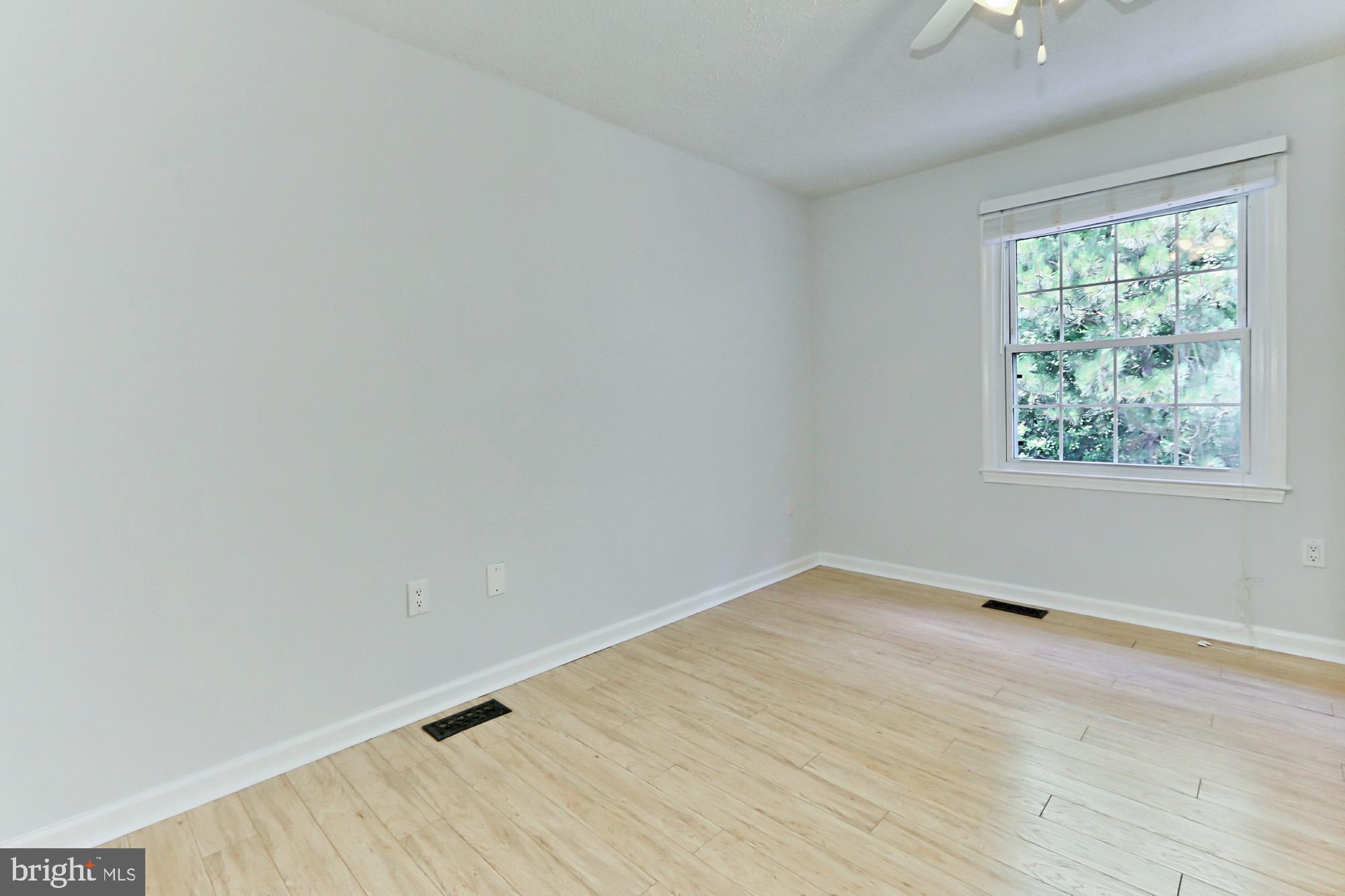 7112 Whetstone Road Alexandria, VA 22306 - Photo 13 of 30 Sunny MBR has a custom closet and Pergo XP floors
