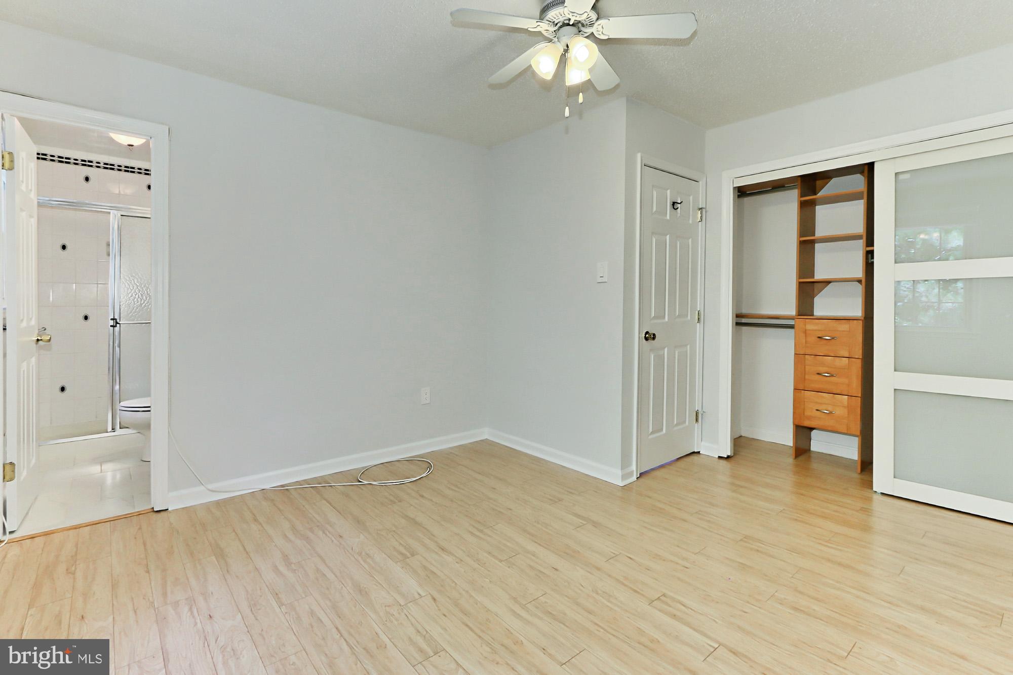 7112 Whetstone Road Alexandria, VA 22306 - Photo 14 of 30 Sunny MBR has a custom closet and Pergo XP floors