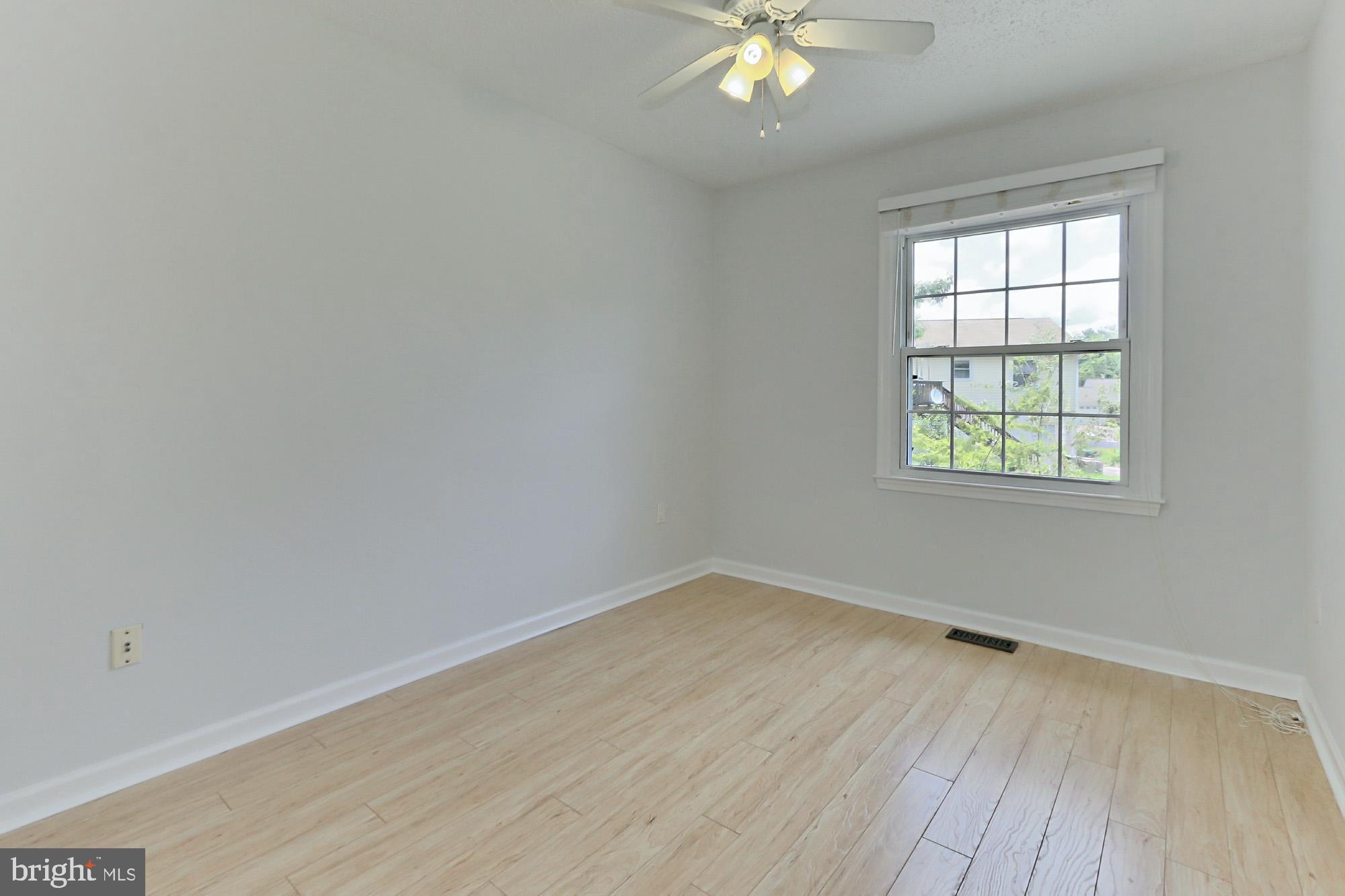 7112 Whetstone Road Alexandria, VA 22306 - Photo 16 of 30 Bright BR with ceiling fan and Pergo XP wood floor