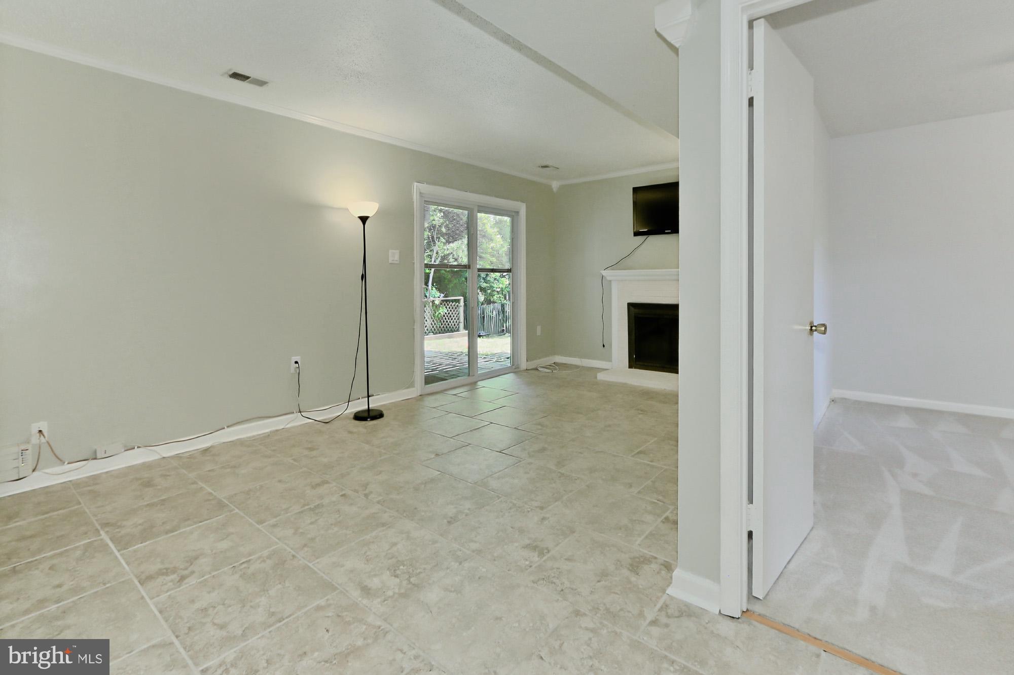 7112 Whetstone Road Alexandria, VA 22306 - Photo 19 of 30 Updated Rec Room w/WB FP and patio/yard access