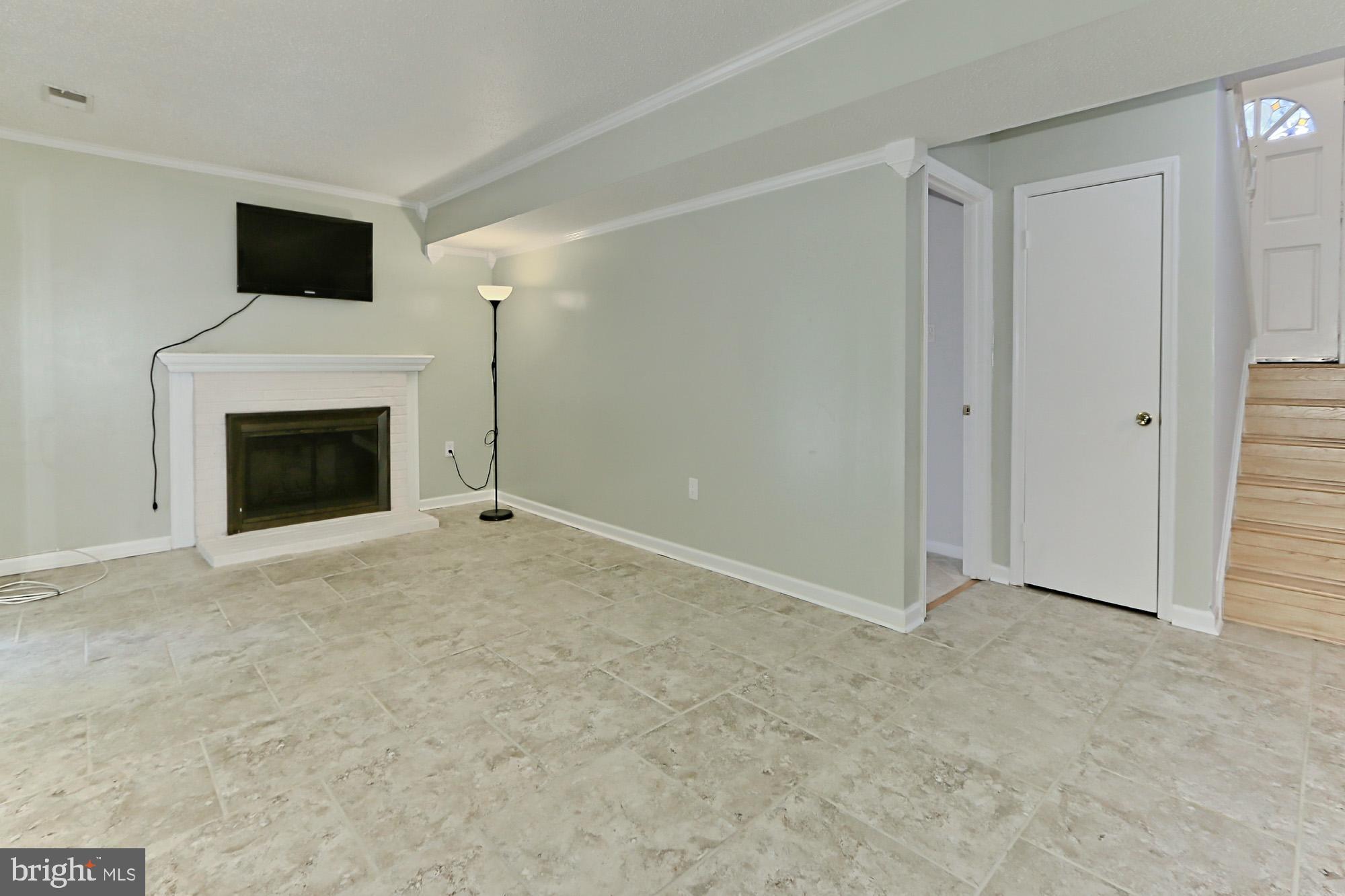 7112 Whetstone Road Alexandria, VA 22306 - Photo 20 of 30 Updated Rec Room w/WB FP and patio/yard access