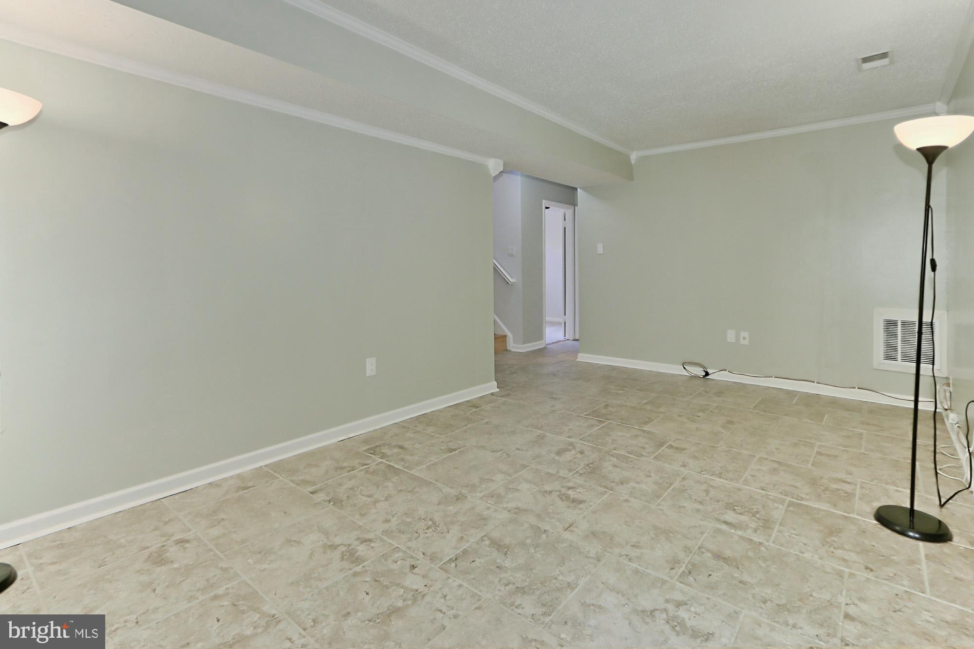 7112 Whetstone Road Alexandria, VA 22306 - Photo 21 of 30 Updated Rec Room w/WB FP and patio/yard access