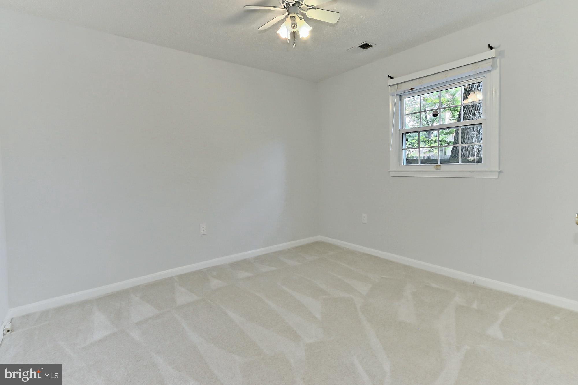 7112 Whetstone Road Alexandria, VA 22306 - Photo 22 of 30 Bedroom with ceiling fan and new carpet