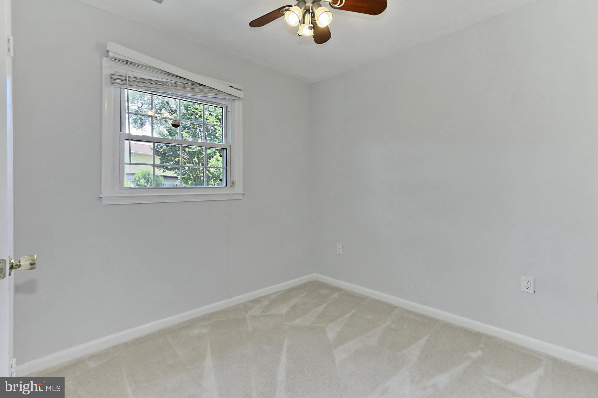 7112 Whetstone Road Alexandria, VA 22306 - Photo 23 of 30 Bedroom with ceiling fan and new carpet