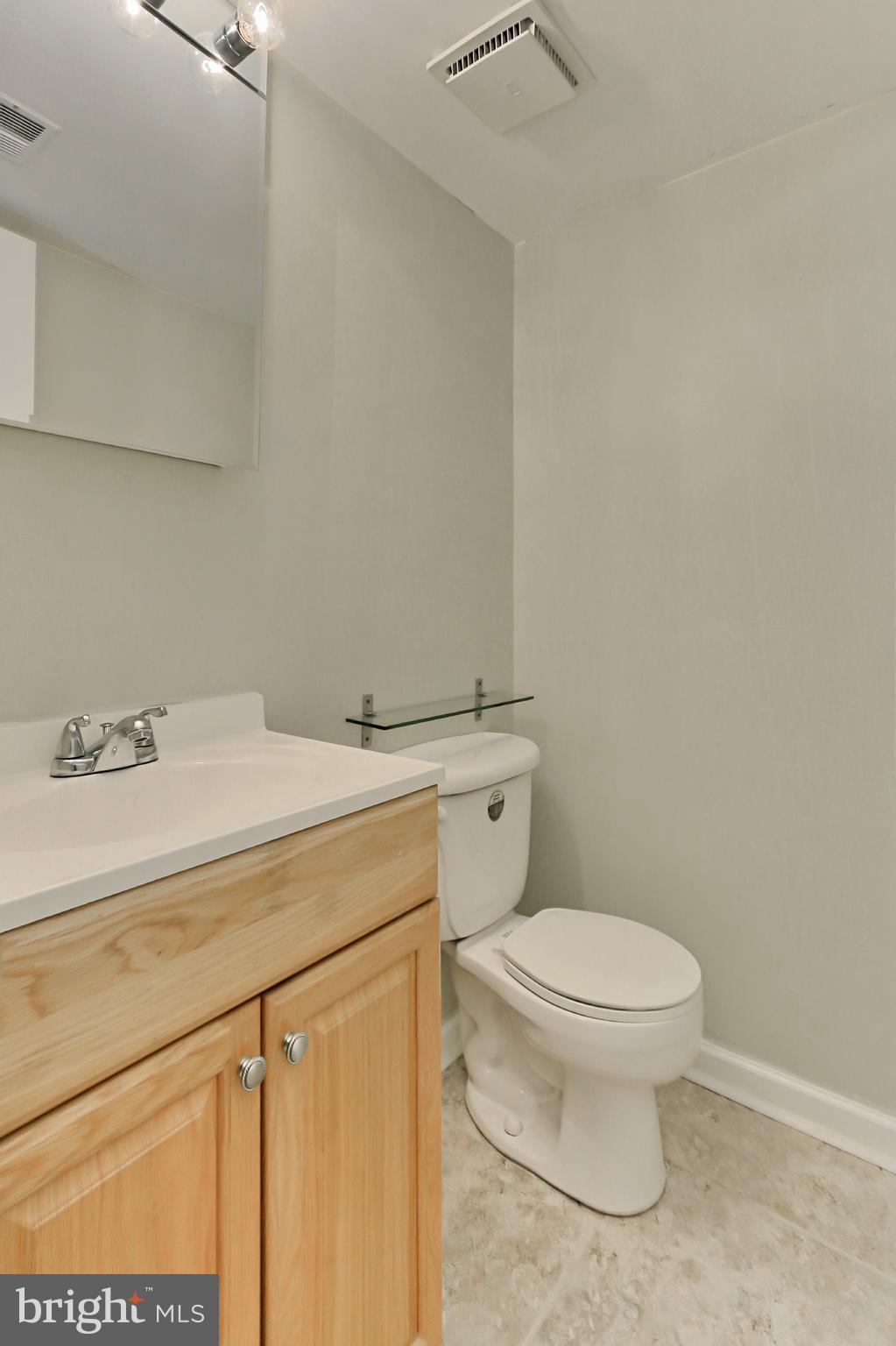 7112 Whetstone Road Alexandria, VA 22306 - Photo 24 of 30 Updated Lower Level Half Bathroom