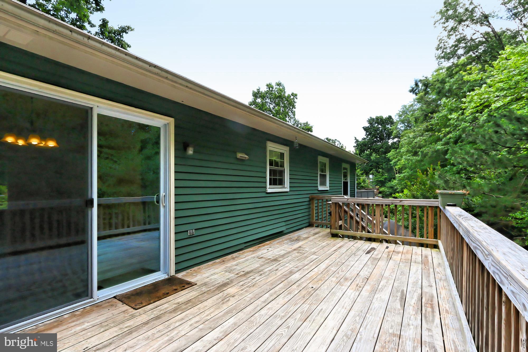 7112 Whetstone Road Alexandria, VA 22306 - Photo 26 of 30 Spacious newer deck w/stairs to the patio and yard