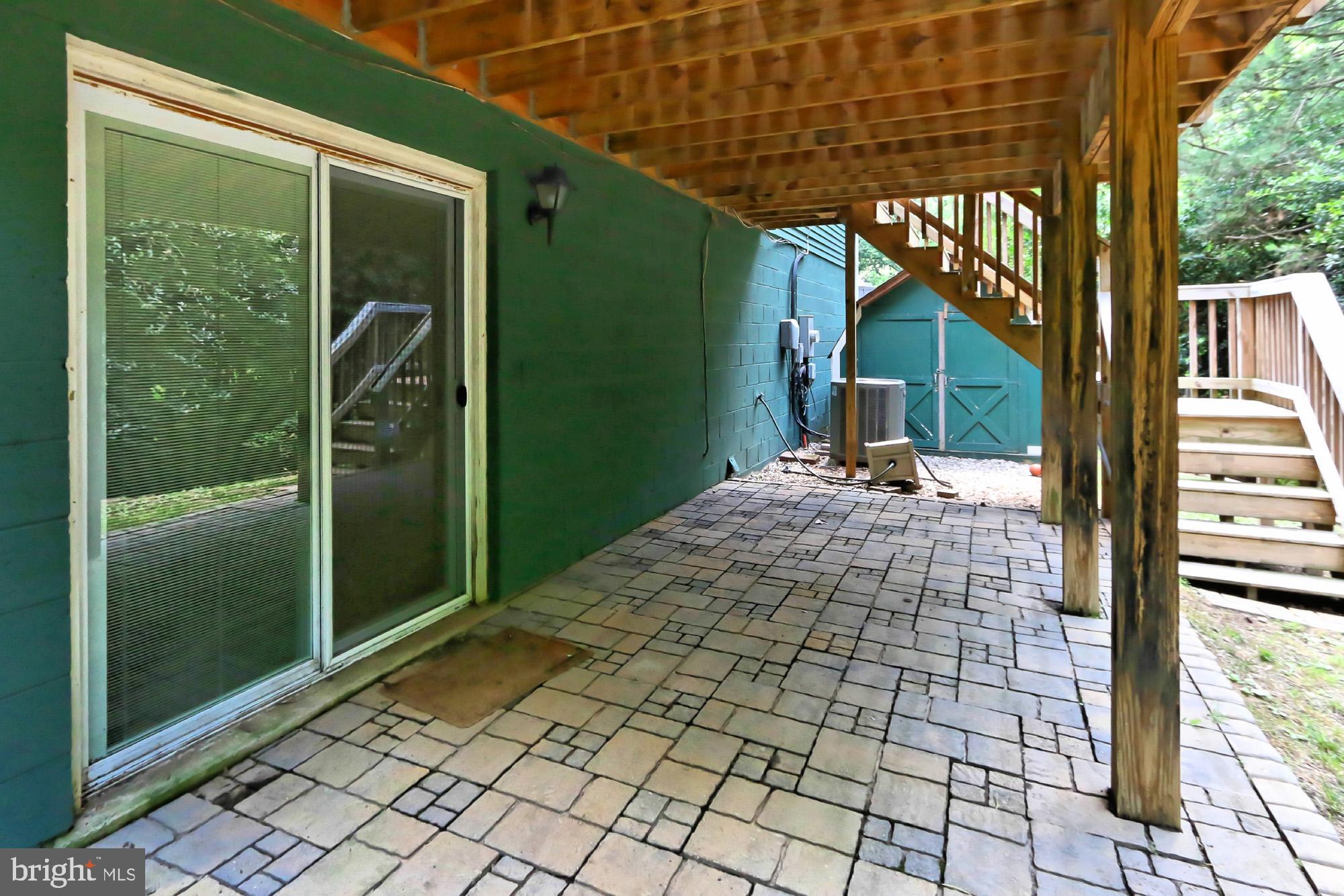 7112 Whetstone Road Alexandria, VA 22306 - Photo 28 of 30 Brick patio leading to large yard