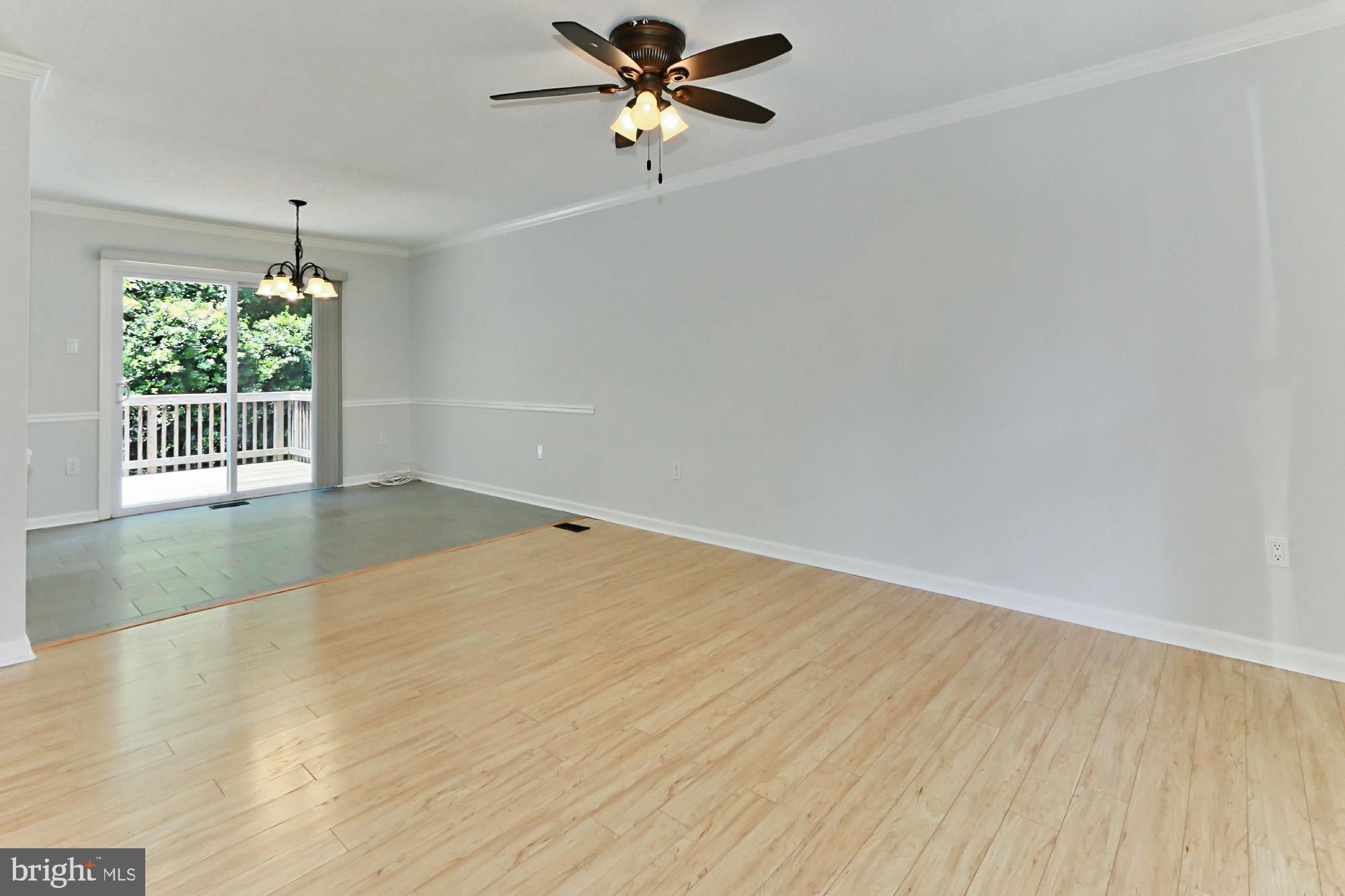 Sun filled Living Room is open to the Dining Room