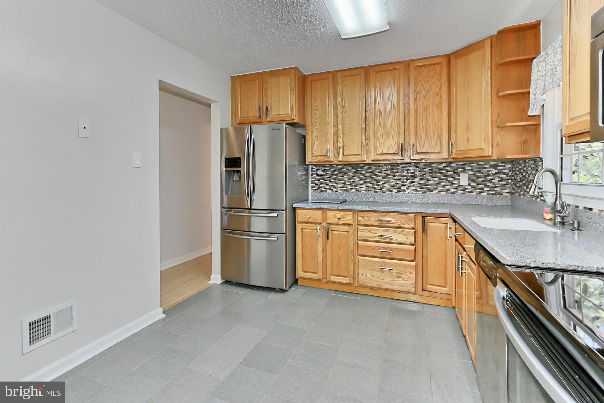 7112 Whetstone Road Alexandria, VA 22306 - Photo 9 of 30 Gorgeous renovated kitchen with table space