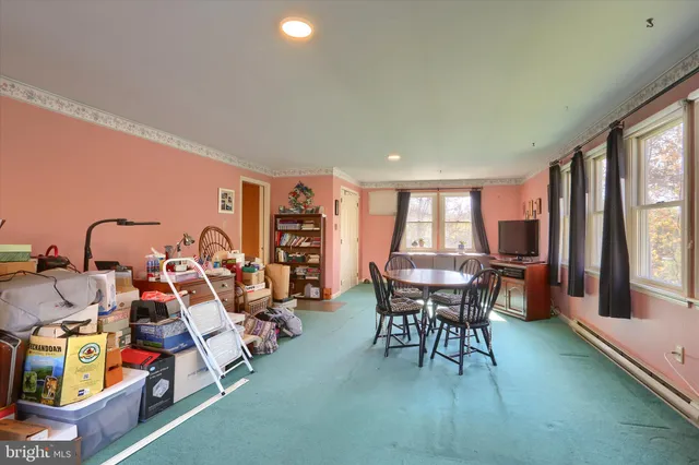 a view of a dining room with furniture window and outside view
