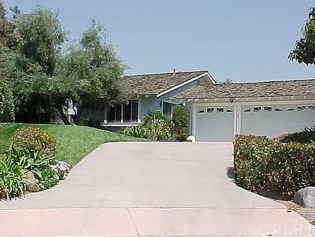 front view of a house with a street