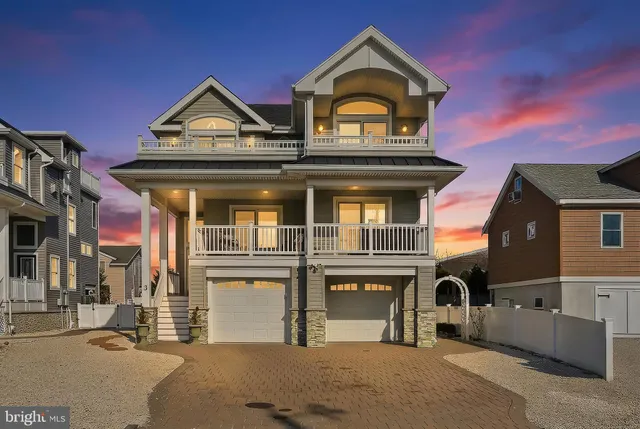 a view of entryway with wooden floor and front door