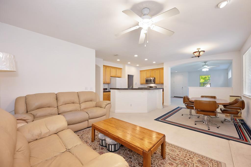 3930 Riley Anton Way Rancho Cordova, CA 95742 - Photo 25 of 45 a living room with furniture and kitchen view