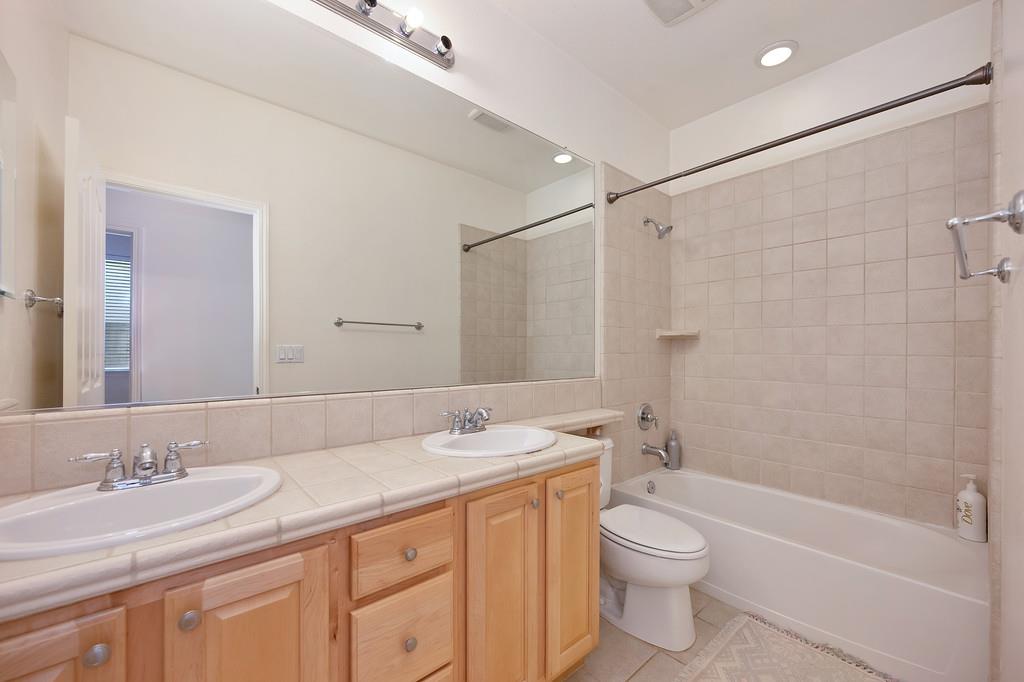 3930 Riley Anton Way Rancho Cordova, CA 95742 - Photo 29 of 45 a bathroom with a granite countertop sink toilet and shower
