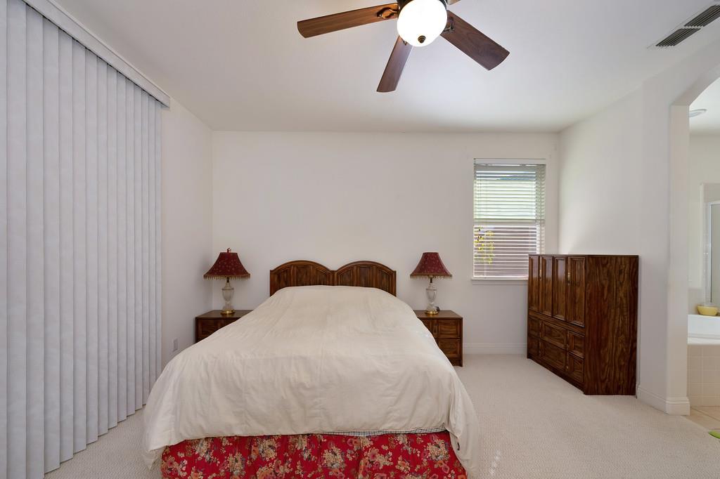 3930 Riley Anton Way Rancho Cordova, CA 95742 - Photo 32 of 45 a bedroom with a bed and a dresser