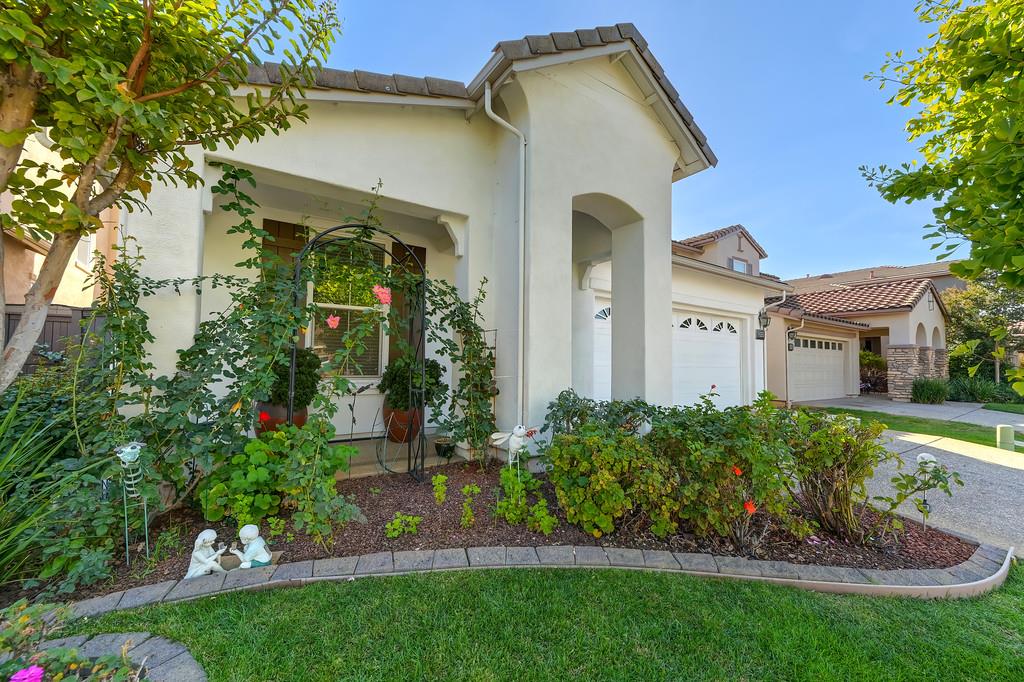 3930 Riley Anton Way Rancho Cordova, CA 95742 - Photo 4 of 45 a front view of a house with a yard