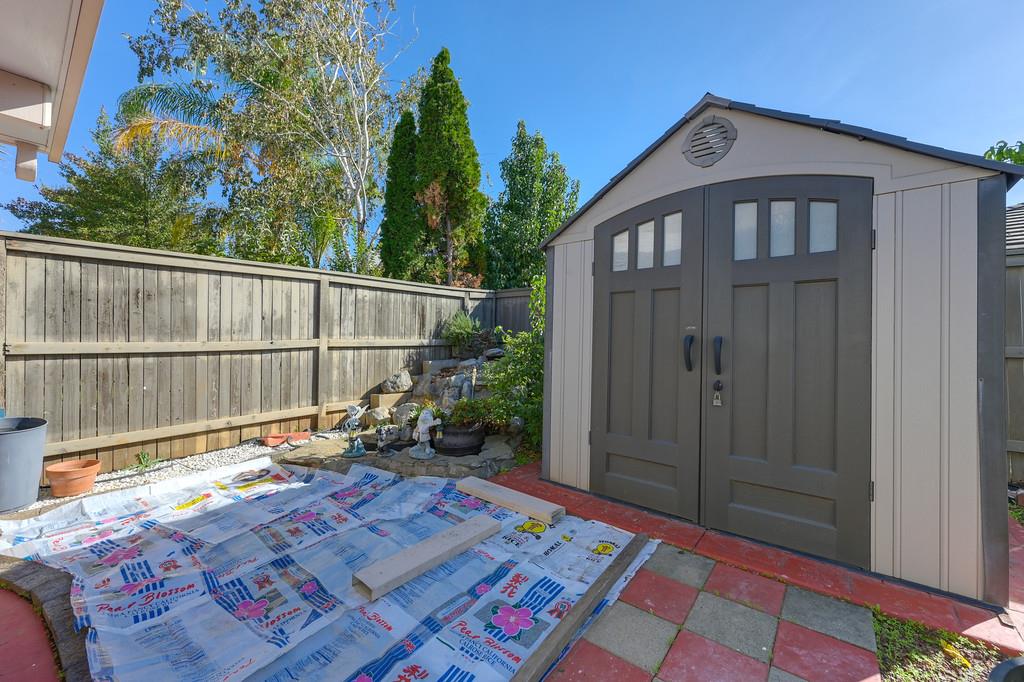 3930 Riley Anton Way Rancho Cordova, CA 95742 - Photo 43 of 45 a view of backyard with a deck and wooden floor