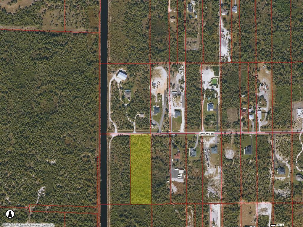 36 Se Avenue Naples, FL 34117 - Photo 2 of 2 a bathroom with a shower