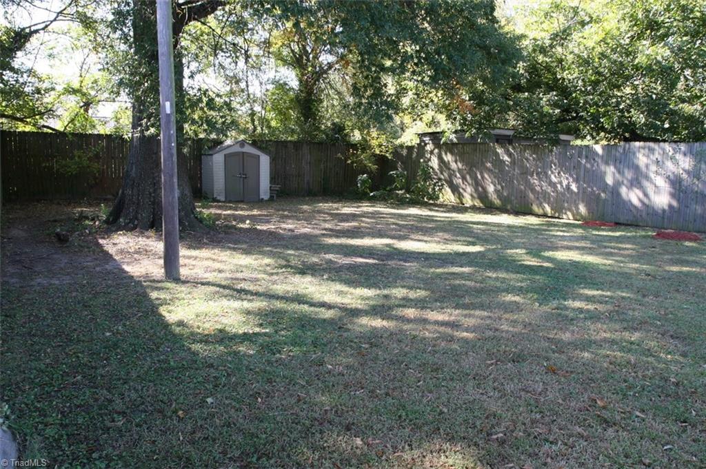 409 Moser Street Graham, NC 27253 - Photo 3 of 18 Back Yard Looking to the Storage Building