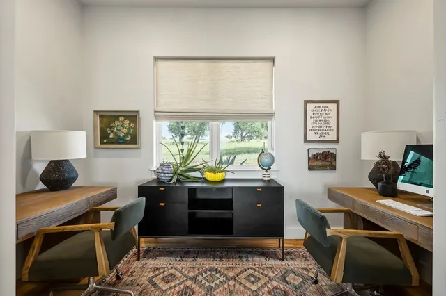 a spacious bedroom with a bed and a dresser