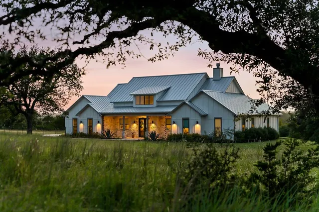 a front view of house with a garden