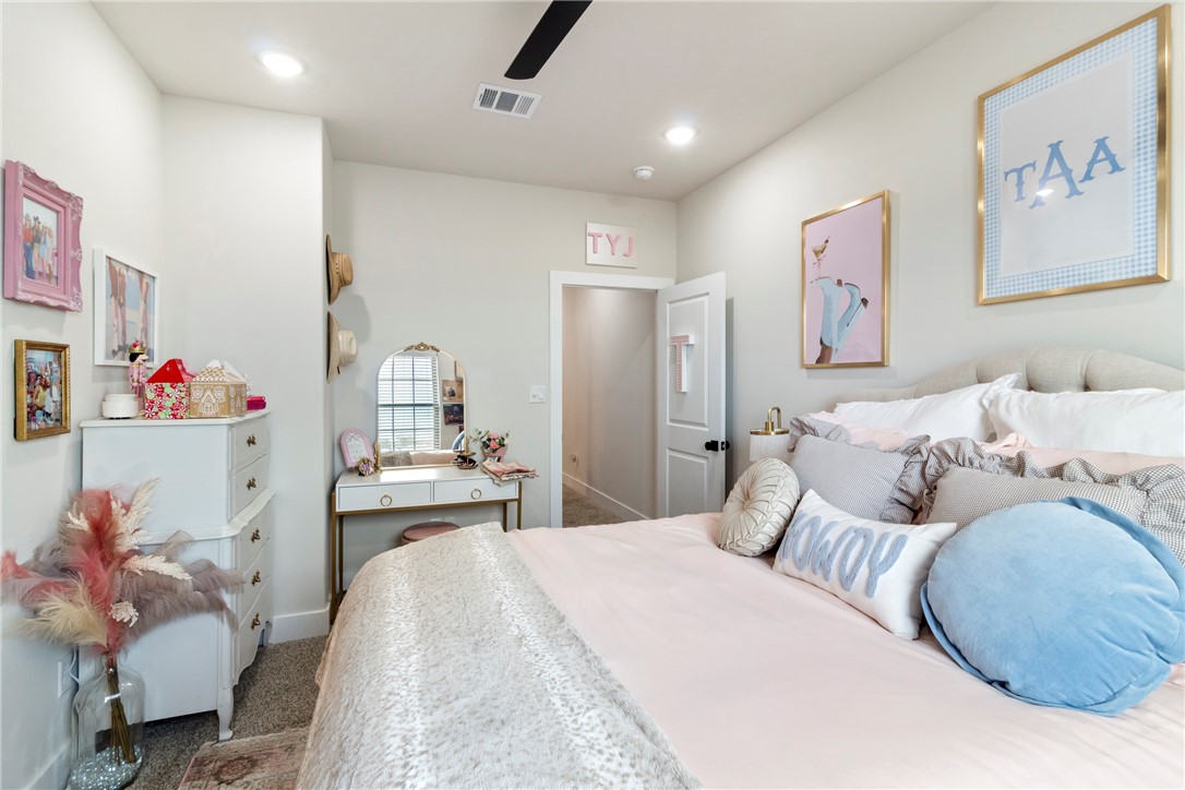 4078 Gunner Trail College Station, TX 77845 - Photo 18 of 33 a bedroom with a bed and a dresser
