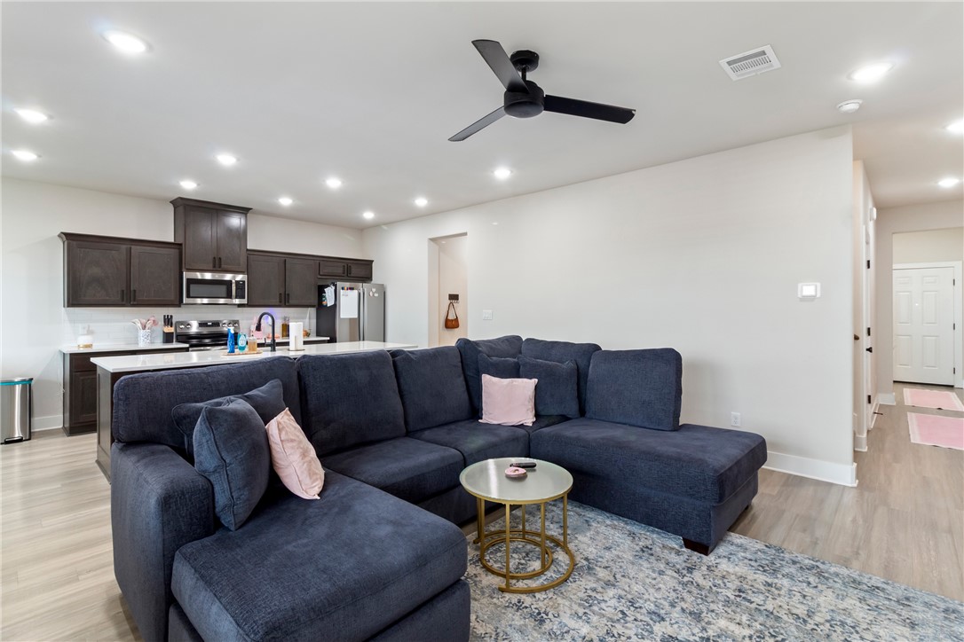 4078 Gunner Trail College Station, TX 77845 - Photo 4 of 33 a living room with furniture and a view of kitchen
