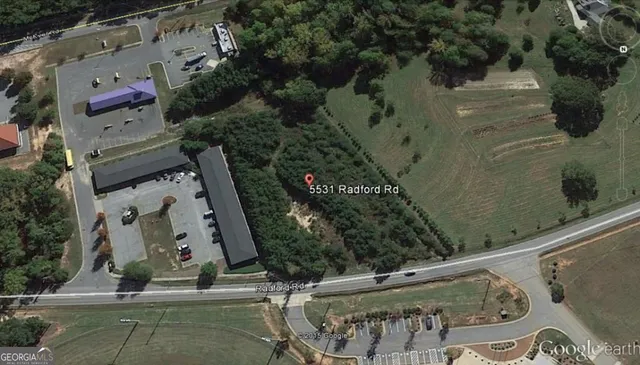 an aerial view of residential house with outdoor space