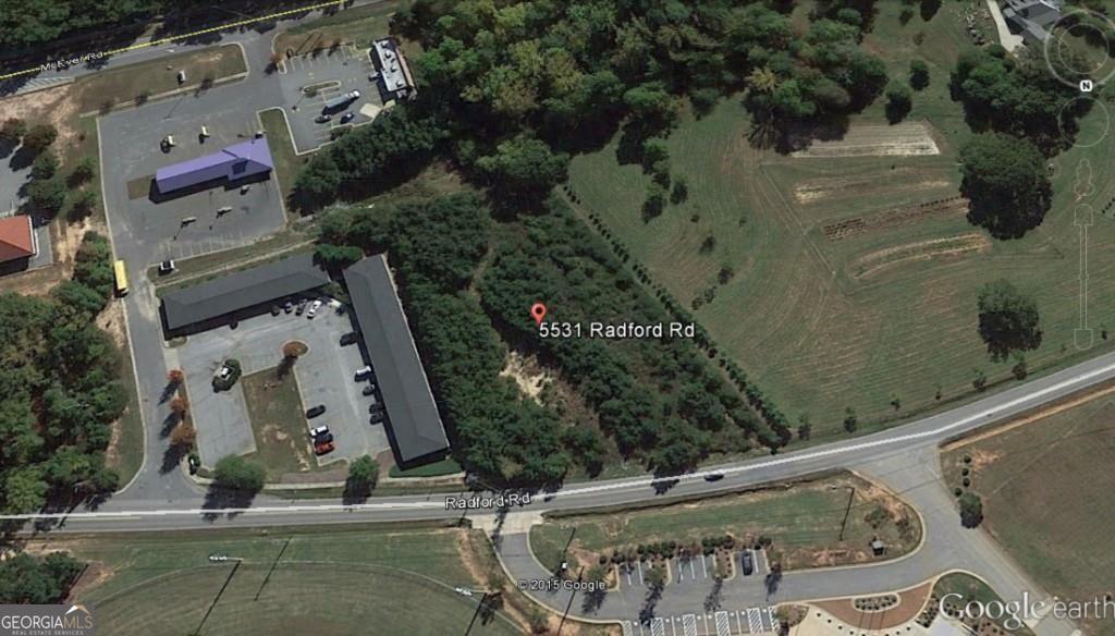 an aerial view of residential house with outdoor space