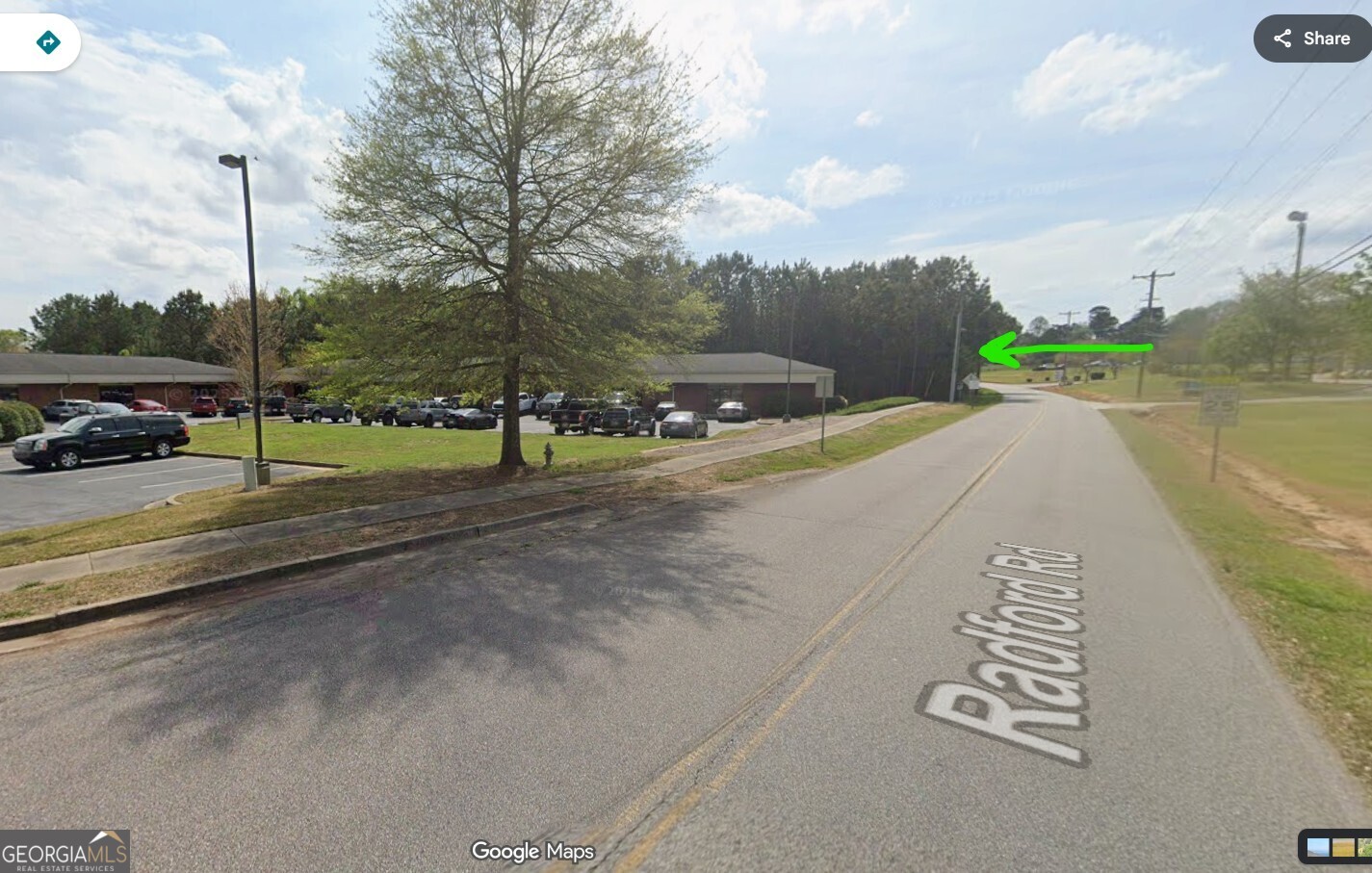 5531 Radford Road Flowery Branch, GA 30542 - Photo 16 of 33 a view of a street with a yard