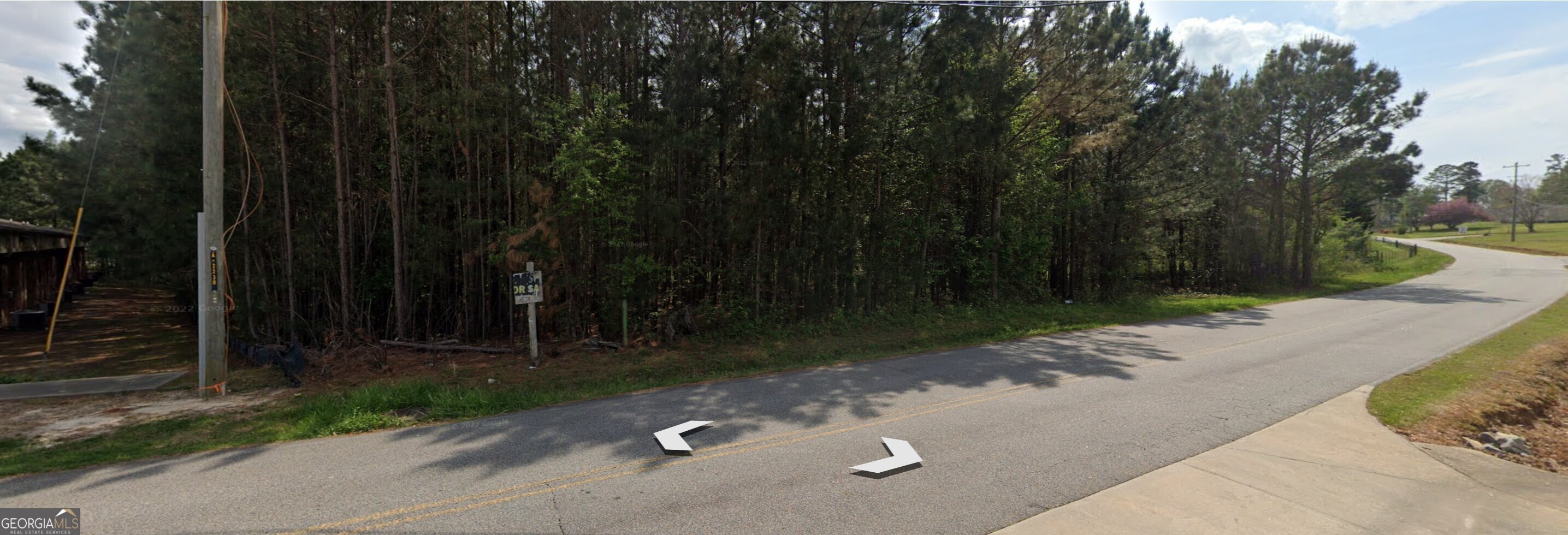 5531 Radford Road Flowery Branch, GA 30542 - Photo 29 of 33 a view of a street with a trees