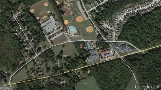 an aerial view of multi story residential building with outdoor space