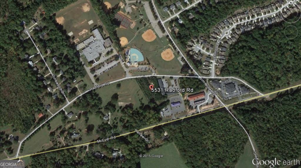 5531 Radford Road Flowery Branch, GA 30542 - Photo 5 of 33 an aerial view of a house with a yard