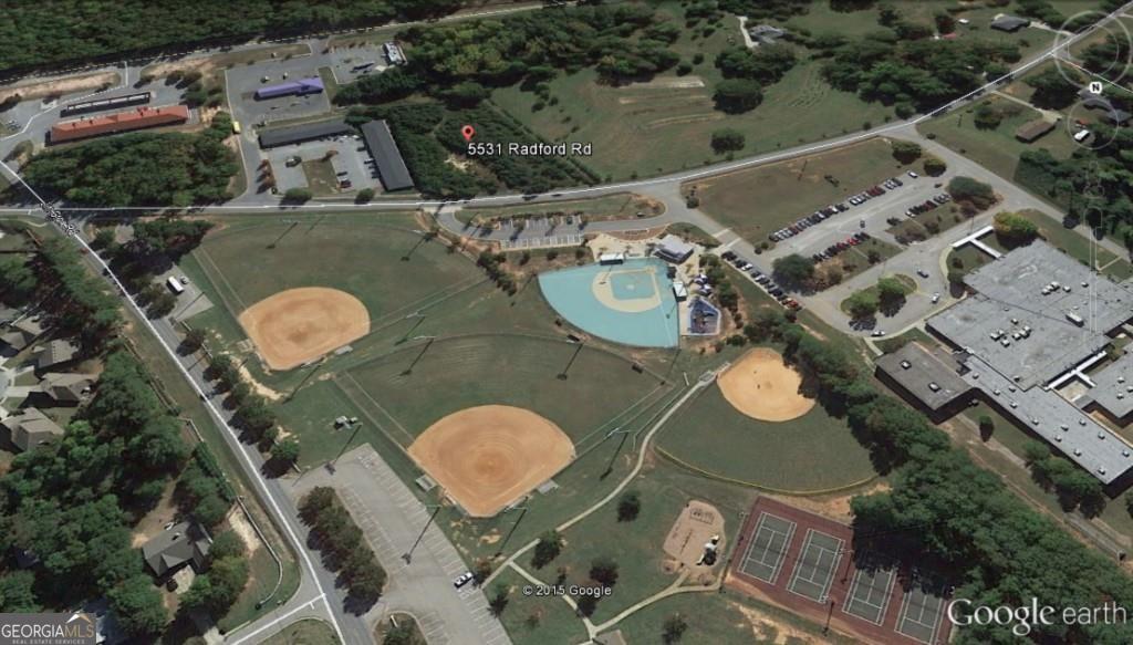 5531 Radford Road Flowery Branch, GA 30542 - Photo 8 of 33 an aerial view of a house with table and chairs