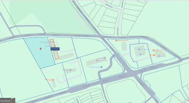 a view of a street with a building in the background