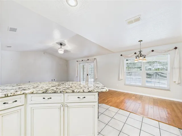 a view of hallway with wooden floor