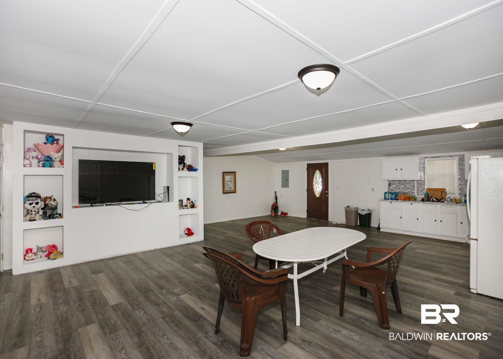 11998 Workman Avenue Foley, AL 36535 - Photo 13 of 59 Dining area featuring dark wood-style flooring