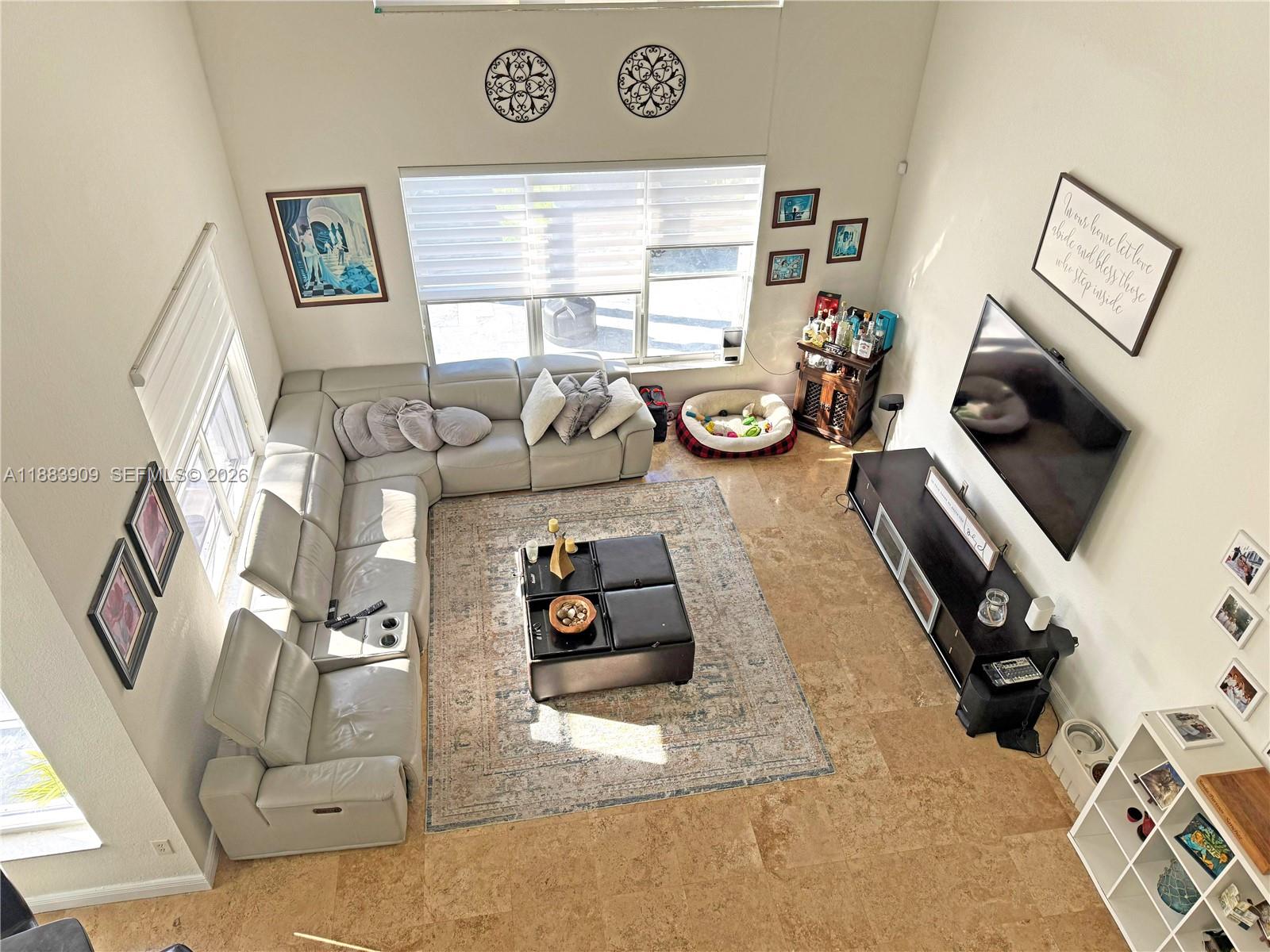 18560 Southwest 44th Street Miramar, FL 33029 - Photo 9 of 16 a view of a workspace with furniture and a window