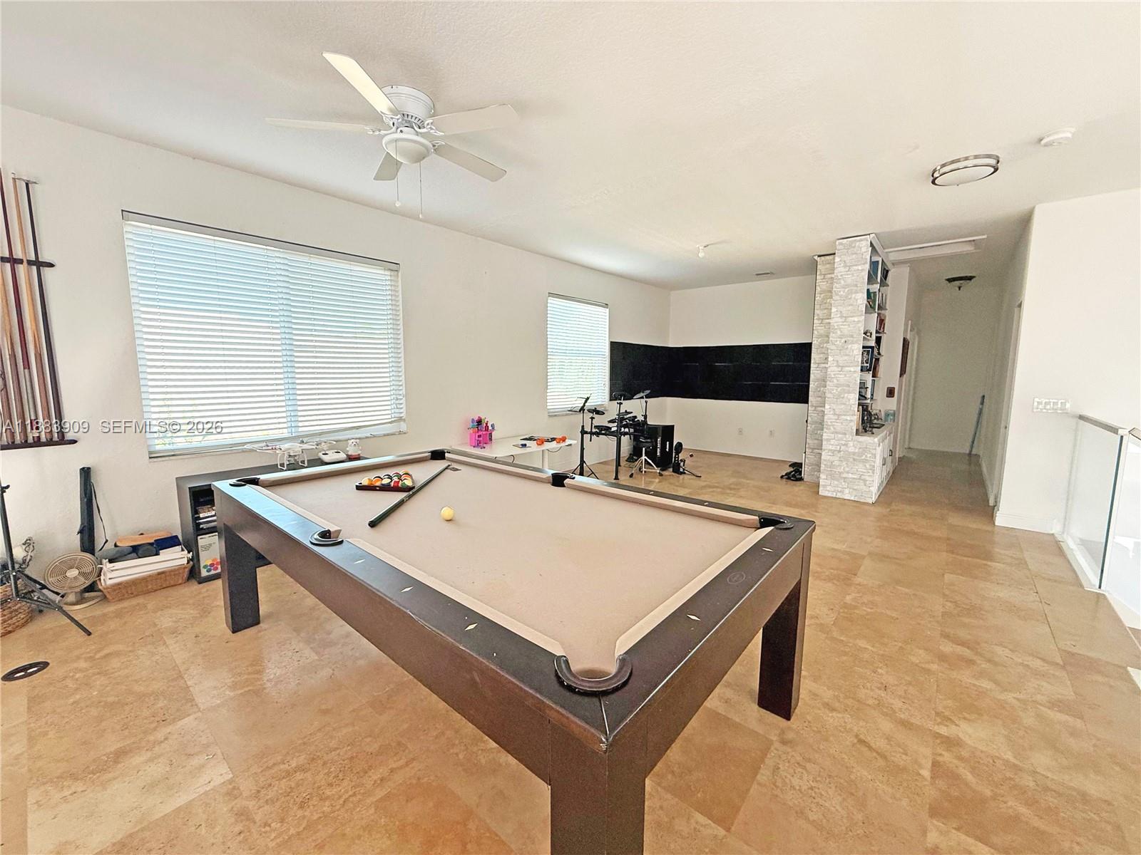 18560 Southwest 44th Street Miramar, FL 33029 - Photo 10 of 16 a room with pool table and flat screen tv
